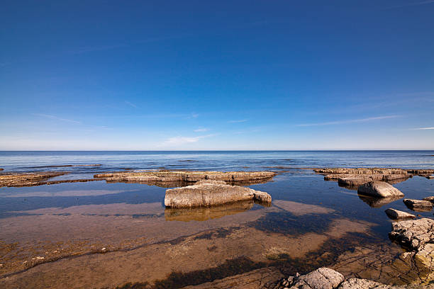 Ocean rocks and blue sky stock photo