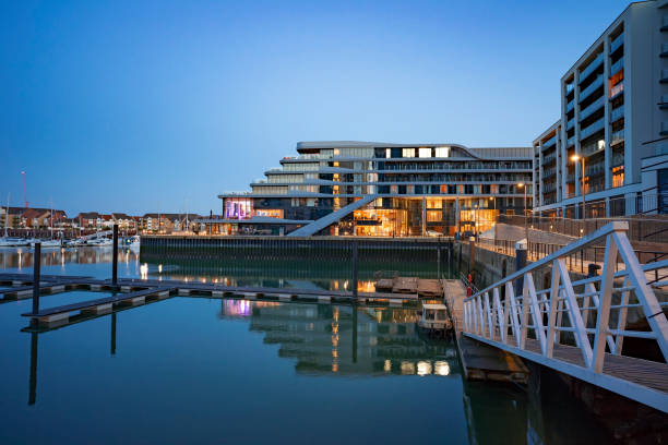 Ocean Village Marina Waterfront Early nightfall at Ocean Village Marina in Southampton, UK english channel photos stock pictures, royalty-free photos & images