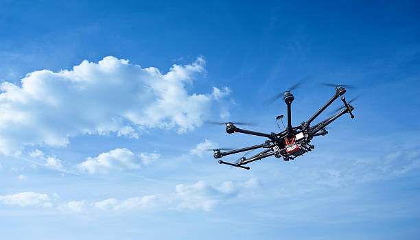 Octocopter, copter, drone Copter flight against the blue sky. RC aerial drone. drone stock pictures, royalty-free photos & images