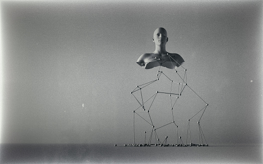 Odd sculpture of a human torso supported by a wire structure, vintage photo effect