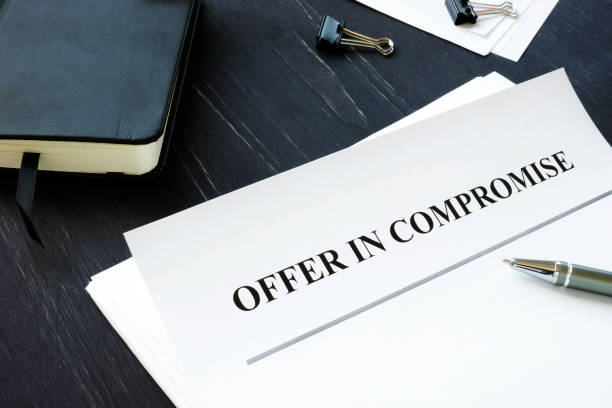 IRS Offer in Compromise OIC agreement and pen. IRS Offer in Compromise OIC agreement and pen. irs stock pictures, royalty-free photos & images