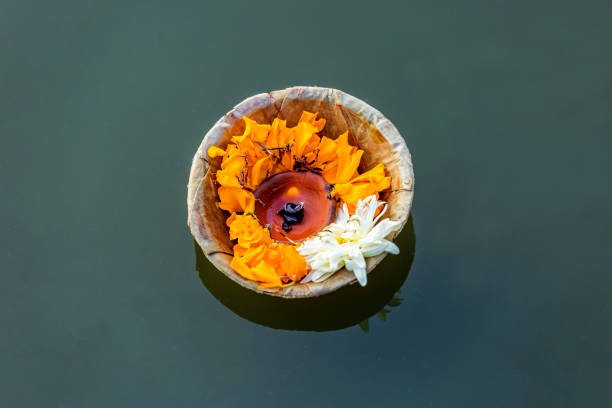 Offerings to God During Chhath Puja Festival Closeup of Butter Lamp with Flowers offered to god at a religious Festival Chhath Puja,Offerings to god during Chath Puja,Hindu Festival chhath stock pictures, royalty-free photos & images