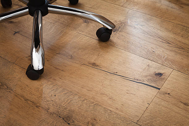Office chair over a rustic oak flooring stock photo