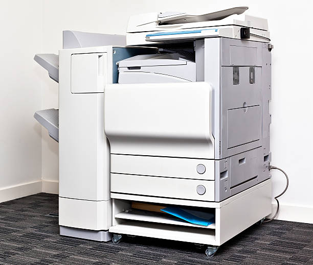 Office copying machine Big grey multi task copy machine in office corner xerox photocopy machine stock pictures, royalty-free photos & images