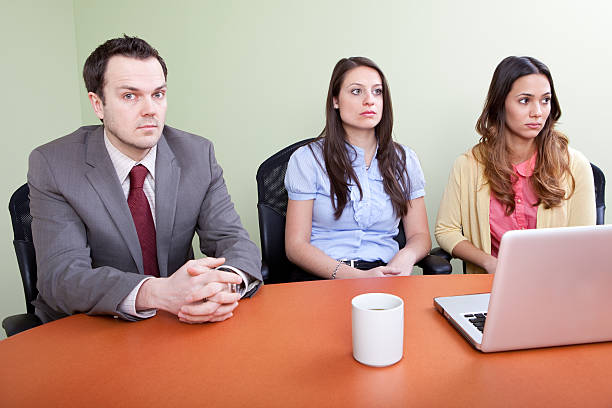 Office workers seems sad during an office meeting stock photo