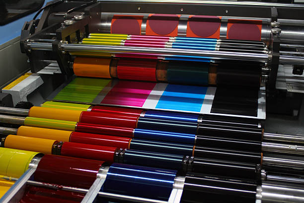 offset printing press cmyk ink rollers - drukken stockfoto's en -beelden