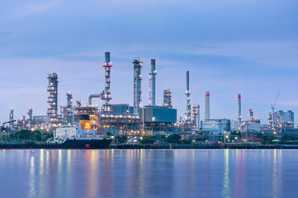 Oil and Gas plant with shipping loading dock at twilight stock photo