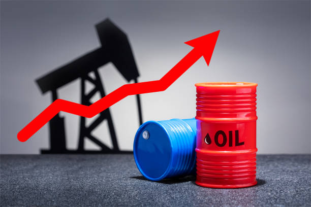 Oil barrels with a red up arrow on grey background. Oil chart. stock photo