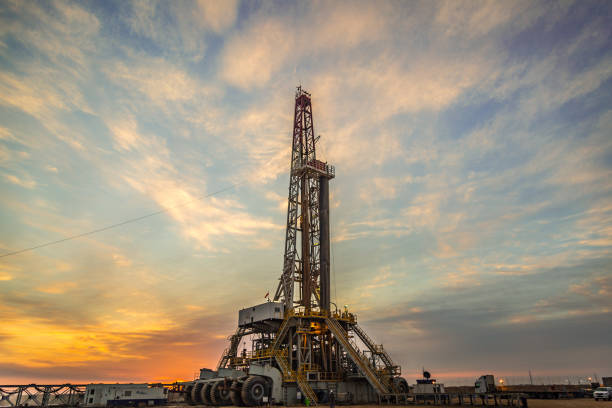 Oil drilling rig at dawn stock photo