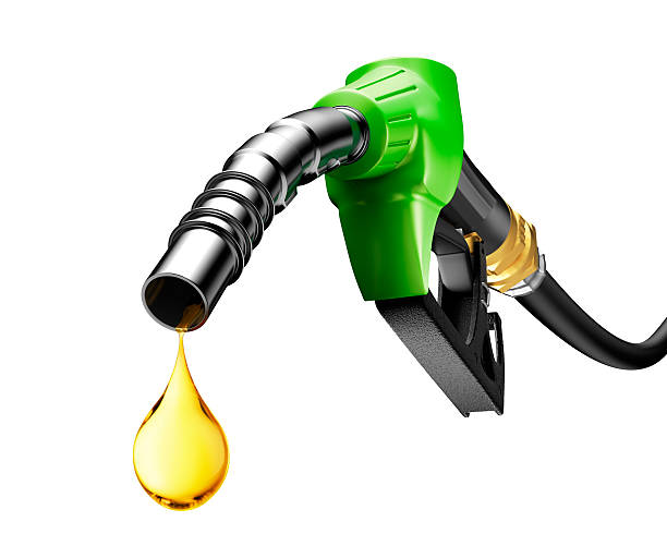 Oil Dripping From a Gasoline Pump Oil dripping from a gasoline pump isolated on white background gas pump stock pictures, royalty-free photos & images
