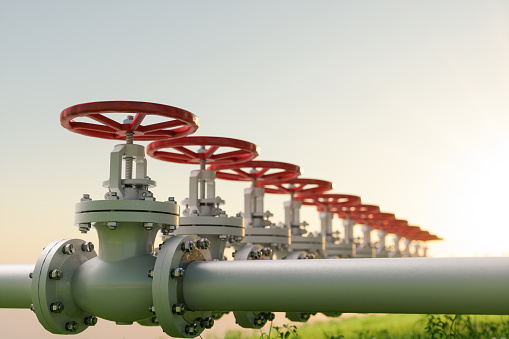 Oil, Gas Or Water Transportation With Pipe Line Valves On Grass.