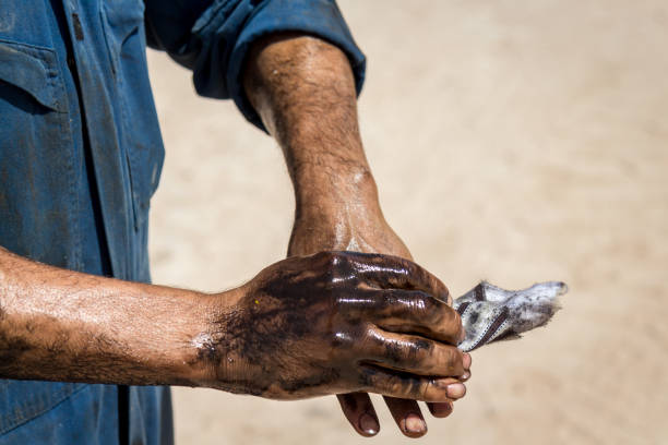 Oil greasy hands stock photo