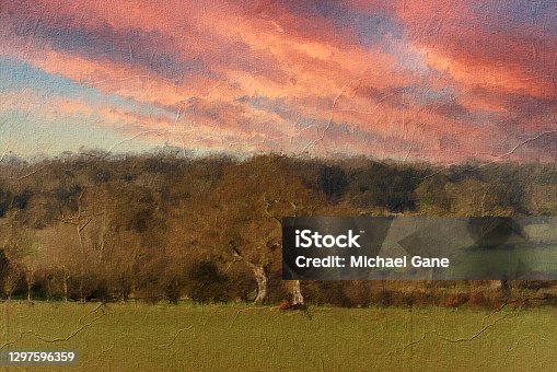 istock Oil painting and sketch of a view across the English countryside with dramatic sunset 1297596359