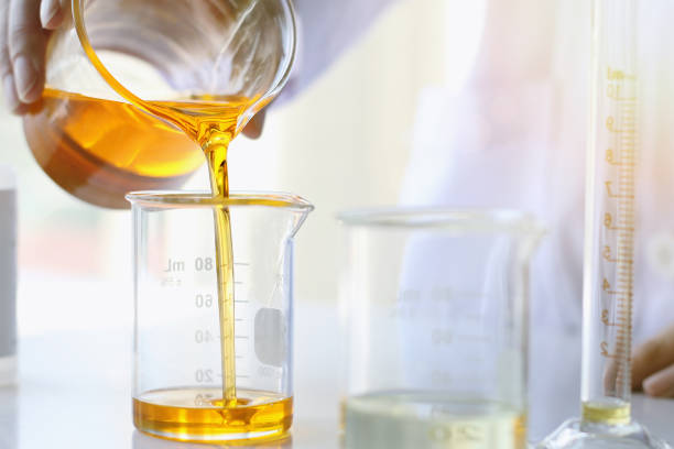 Oil pouring, Equipment and science experiments, Formulating the chemical for medicine, Organic pharmaceutical stock photo
