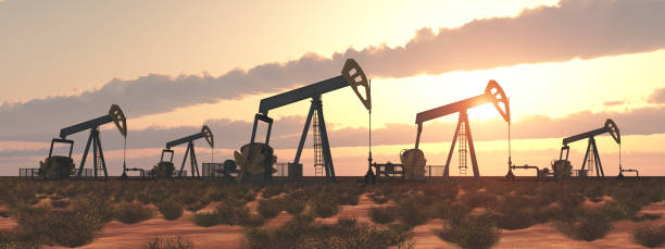 Oil pumps at sunset stock photo