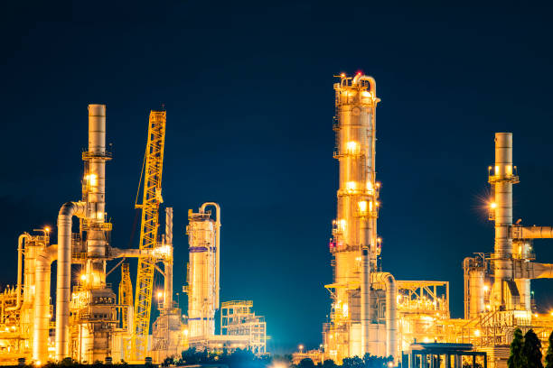Oil refinery at night Oil refinery at night oil refinery stock pictures, royalty-free photos & images
