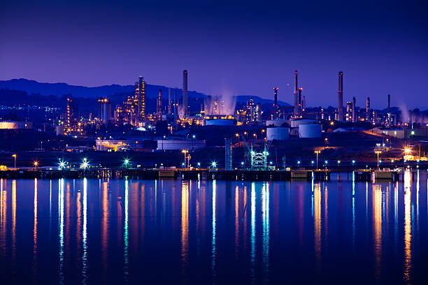 Oil Refinery on the Carquinez Strait A large oil refinery and chemical plant on the Carquinez Strait in the San Francisco Bay Area is light up at night. oil refinery stock pictures, royalty-free photos & images