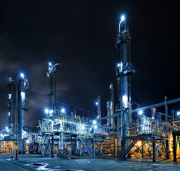 Oil Refinery Oil Refinery, Chemical & Petrochemical plant abstract at night. oil refinery factory stock pictures, royalty-free photos & images