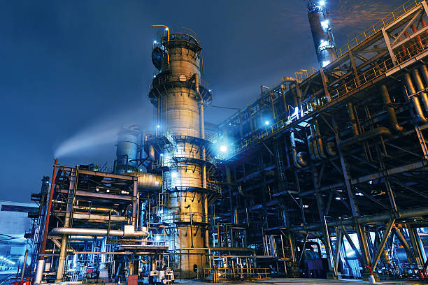 Oil Refinery Oil Refinery, chemical & petrochemical plant at night. oil refinery stock pictures, royalty-free photos & images