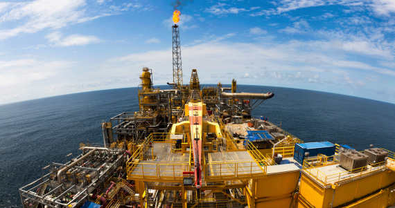 Wide angle fisheye view of a large FPSO type oil rig.