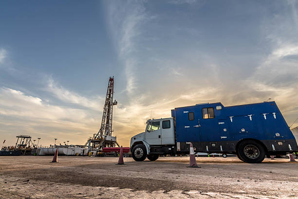oil rig site oil rig parking space and big truck oil field stock pictures, royalty-free photos & images