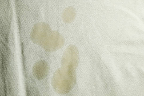 Oil stain on white cloth stock photo