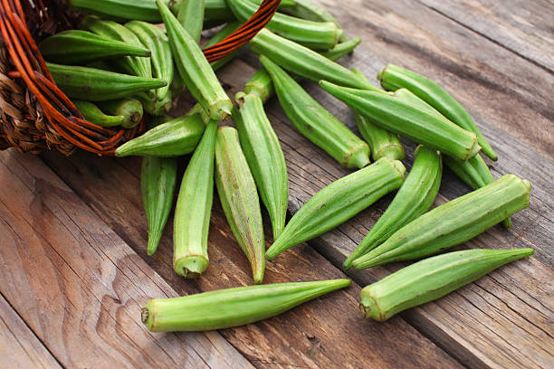 Okra Lady Fingers or Okra over wooden table background okra plants pics stock pictures, royalty-free photos & images