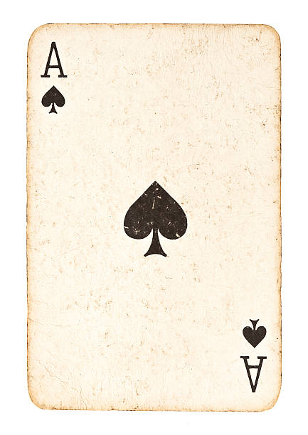 old ace of spades isolated on white - aas kaarten stockfoto's en -beelden