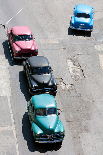 High angle view of an old American cars goes down the street in Havana, Cuba