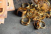 istock Old and broken jewelry  and on Euro banknotes on dark background. Sell gold for money  concept. 1393966935