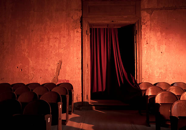 Old and empty dark theater with red curtains Old theatre curtain photos stock pictures, royalty-free photos & images