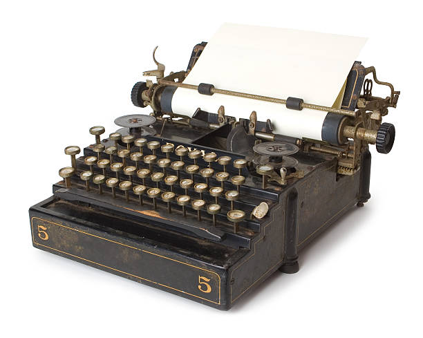 A old antique typewriter with blank paper stock photo