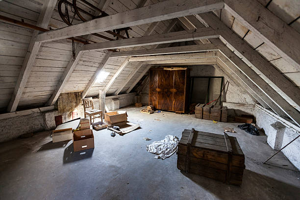 Old attic with hidden secrets of an abandoned house stock photo