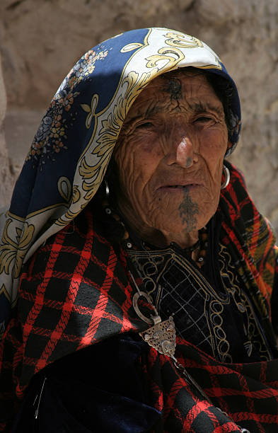 Old Barber woman. Matmata, Tunisia - July 10, 2009: Portrait of old Berber woman in traditional clothes and jewelry. Living in the desert left marks on her skin. tunisia woman stock pictures, royalty-free photos & images