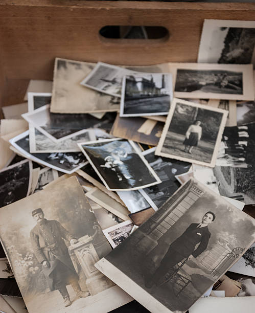 Old black and white and sepia photos at flea market. stock photo