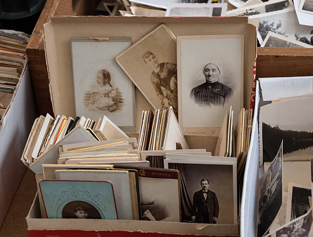 Old black and white and sepia photos at flea market. stock photo