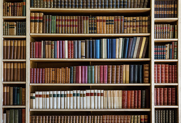 old books bookcase with many old books in a library bookshelf stock pictures, royalty-free photos & images