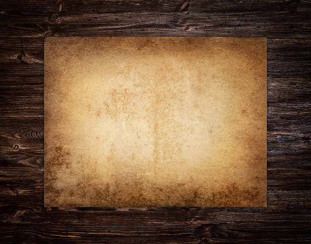 Old brown paper Old paper on the wood background. wild west stock pictures, royalty-free photos & images