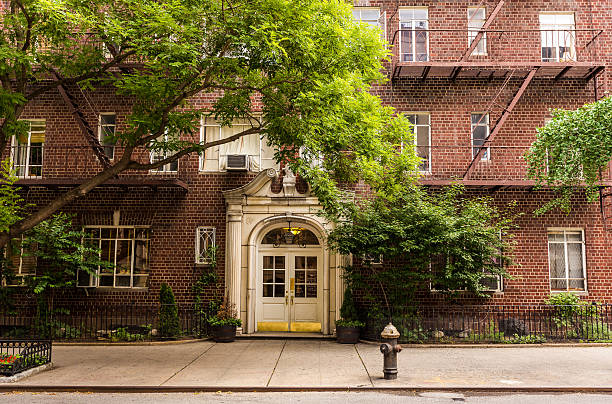 Old brownstone apartment building in Manhattan, New York city. stock photo