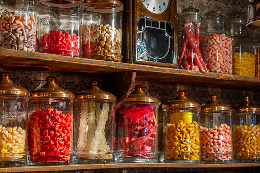 Old candy store. Colorful candies in jars. Old fashioned retro style