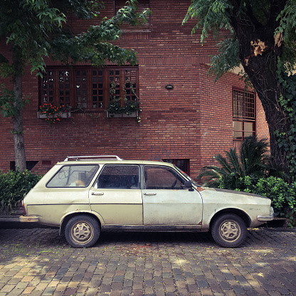 Vintage station wagon parked next to sidewalk in Buenos Aires street, Argentina