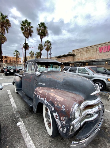 Santa Monica, USA - December 23, 2019: Old Chevrolet parked near Vons Supermarket in Santa Monica, USA