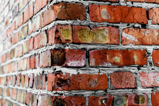 Old corner masonry of red bricks stock photo