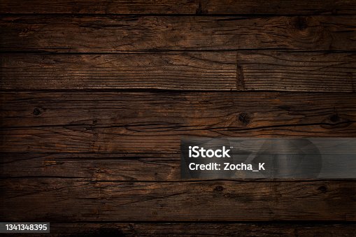 istock Old dark brown wooden board 1341348395