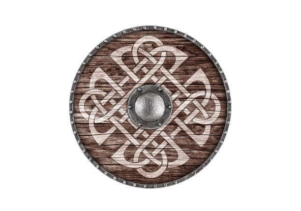 Old decorated wooden round shield isolated on white background stock photo