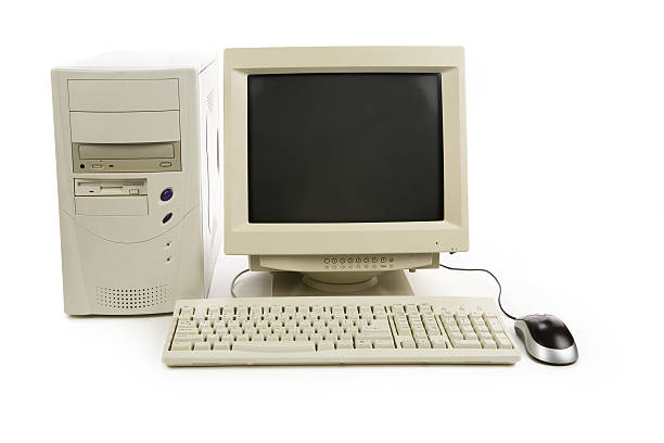 Old desktop computer with mouse stock photo