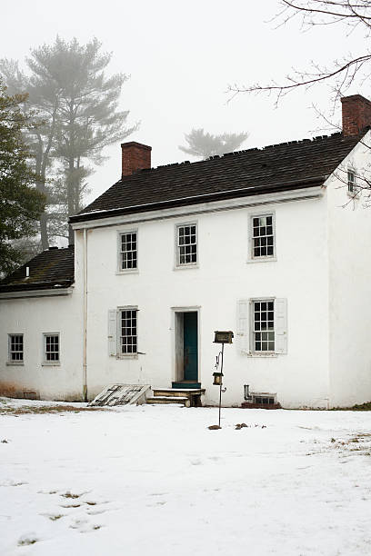 old empty house on foggy winter day stock photo