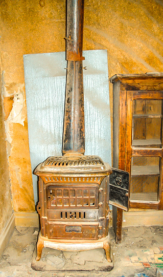 An abandoned house with all its contents. The curio cabinet was left behind in the ghost town of Bodie, California.