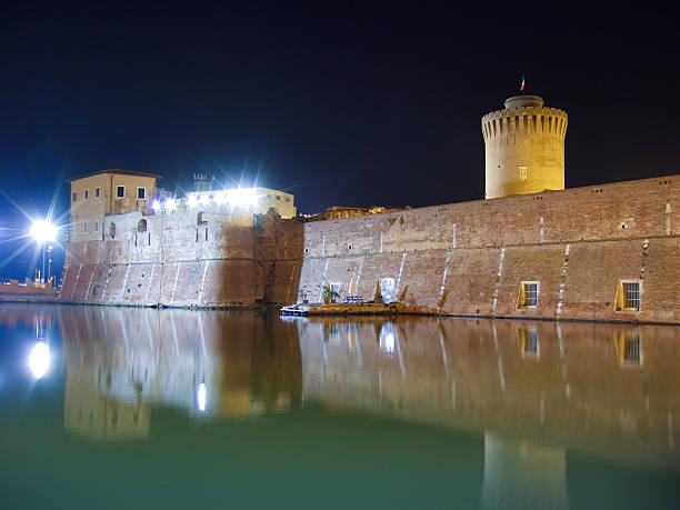 Old Fortress by night in Leghorn, Italy Old Fortress by night in Leghorn, Italy. It is a Medicean fortification built in XVI century white leghorn stock pictures, royalty-free photos & images