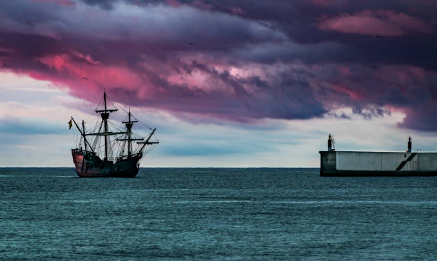 Old Galeon entering port Replica of an ancient galleon galleon stock pictures, royalty-free photos & images